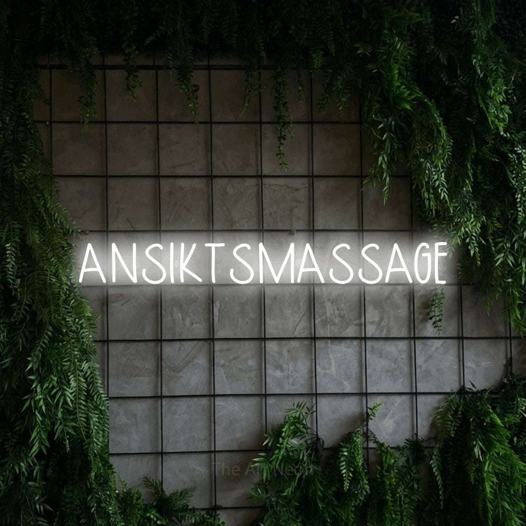 LED neon sign reading “ANSIKTSMASSAGE”, arranged in a single line.