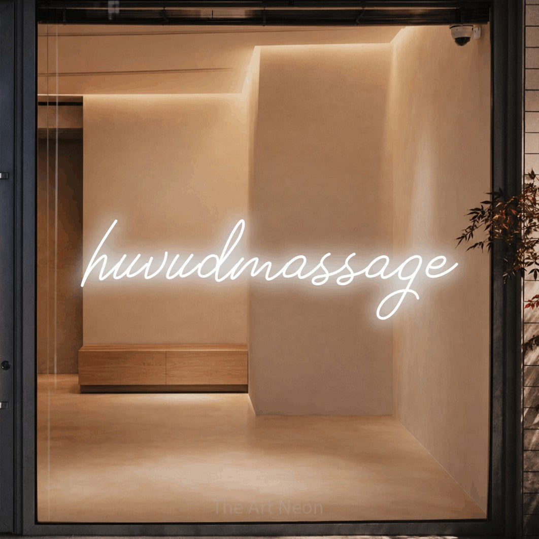 LED neon sign reading “huvudmassage”, arranged in a single line.
