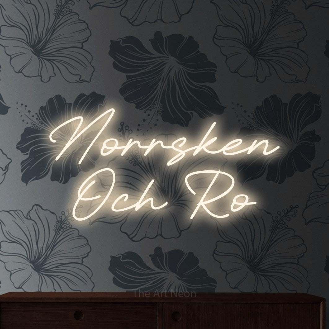 LED neon sign reading “Norrsken Och Ro”, arranged in 2 lines.