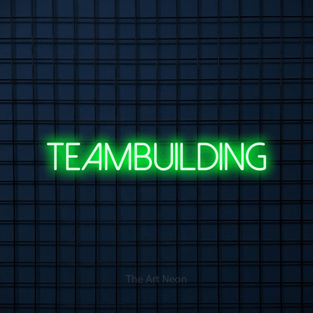 LED neon sign reading “teambuilding”, arranged in a single line.