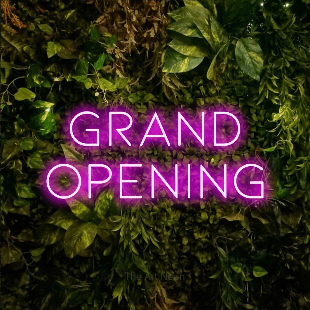 LED neon sign reading “grand opening”, arranged in 2 lines.