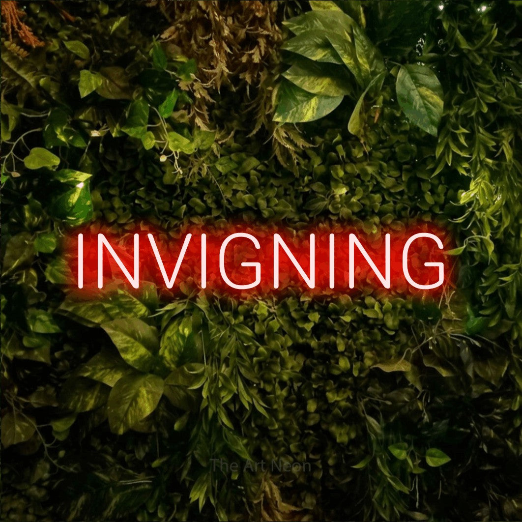 LED neon sign reading “INVIGNING”, arranged in a single line.