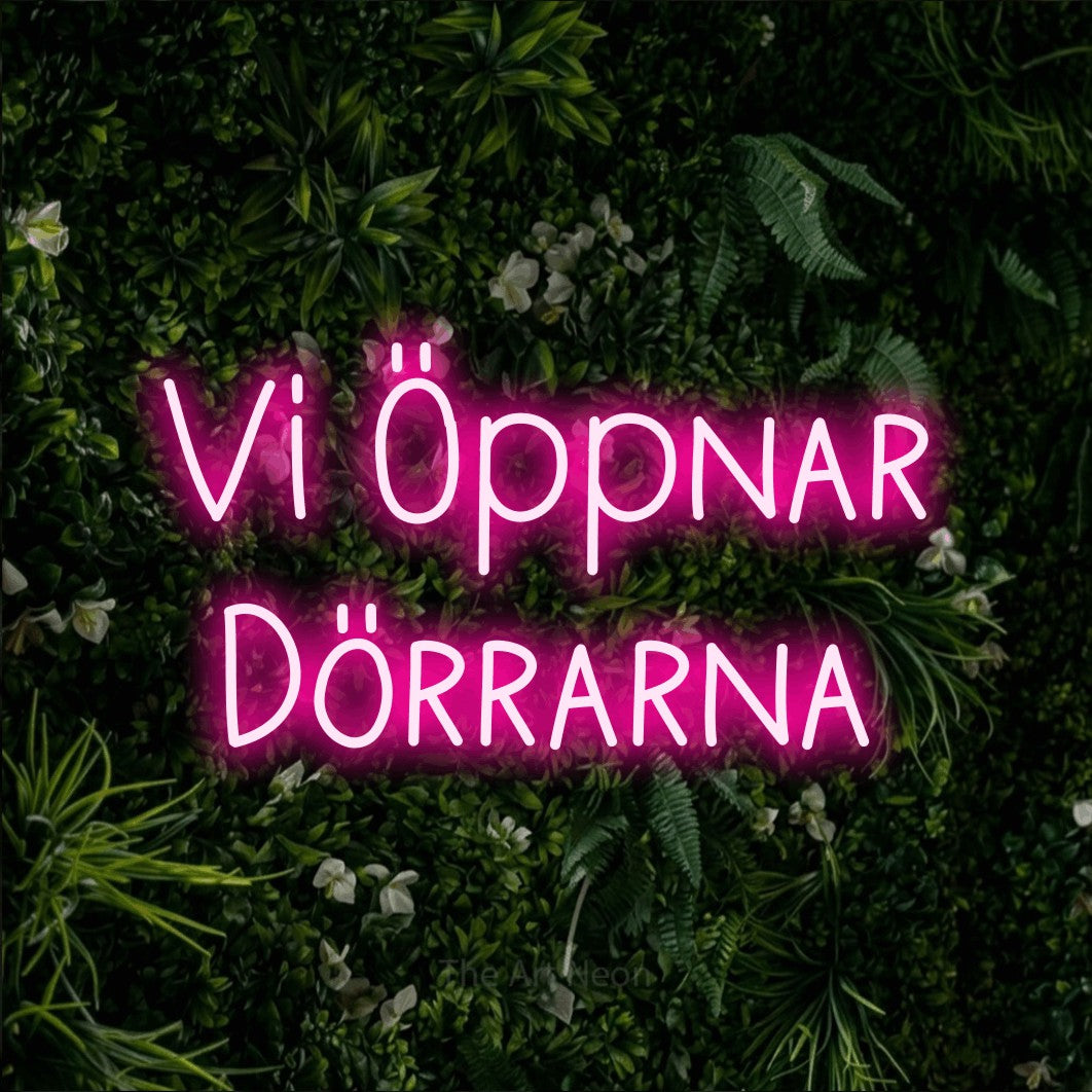 LED neon sign reading “Vi Öppnar Dörrarna”, arranged in 2 lines.