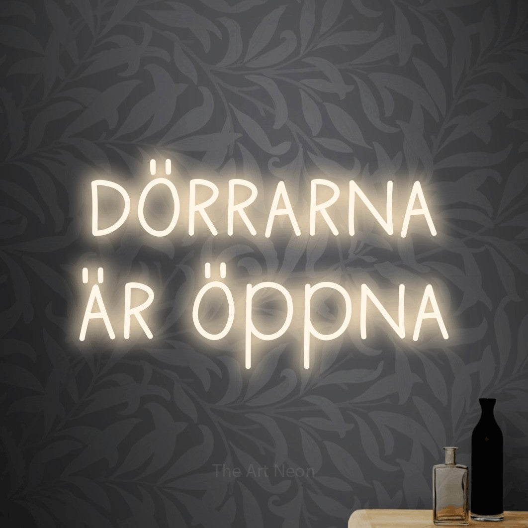 LED neon sign reading “dörrarna är öppna”, arranged in 2 lines.