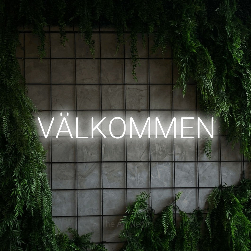 LED neon sign reading “VÄLKOMMEN”, arranged in a single line.