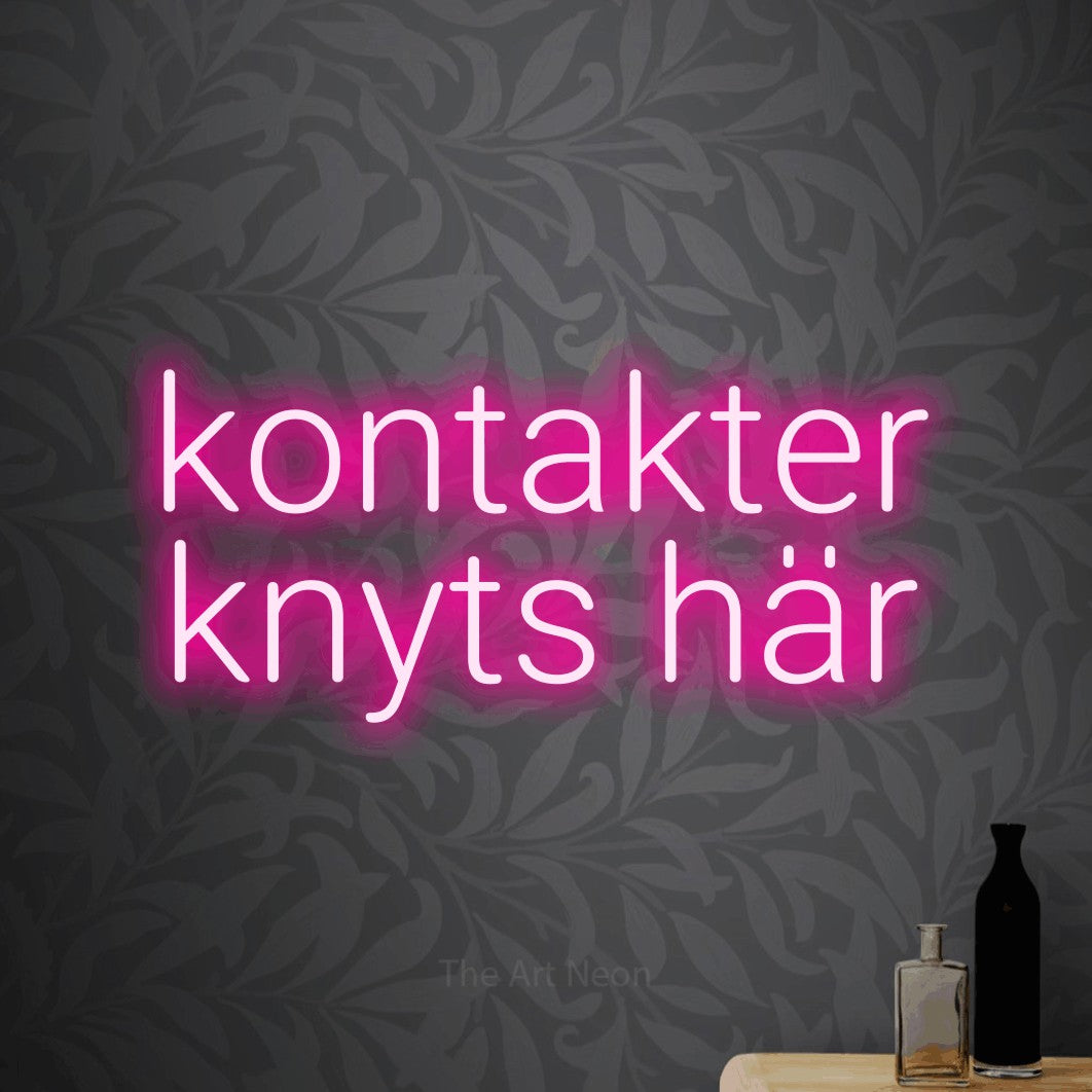 LED neon sign reading “kontakter knyts här”, arranged in 2 lines.