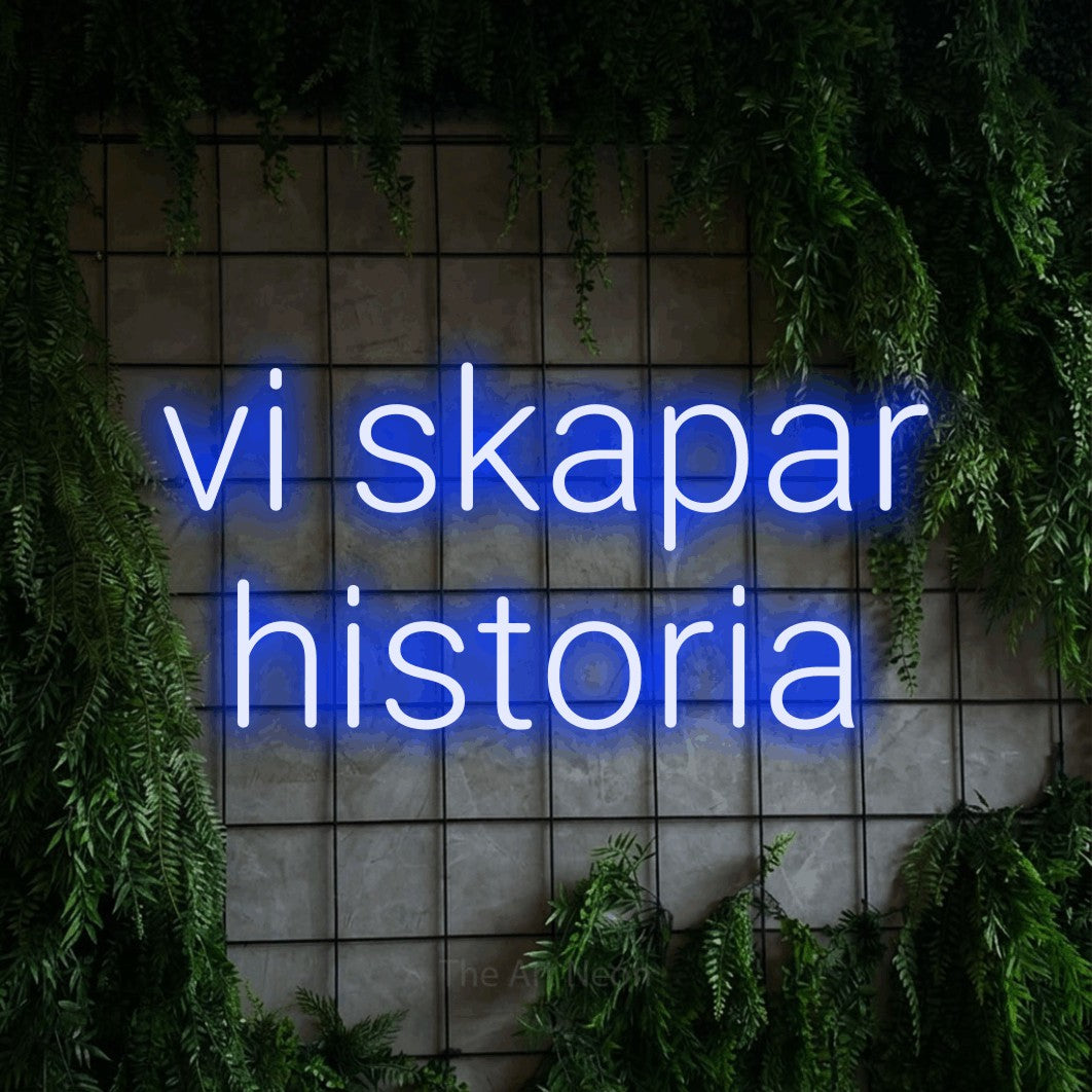 LED neon sign reading “vi skapar historia”, arranged in 2 lines.