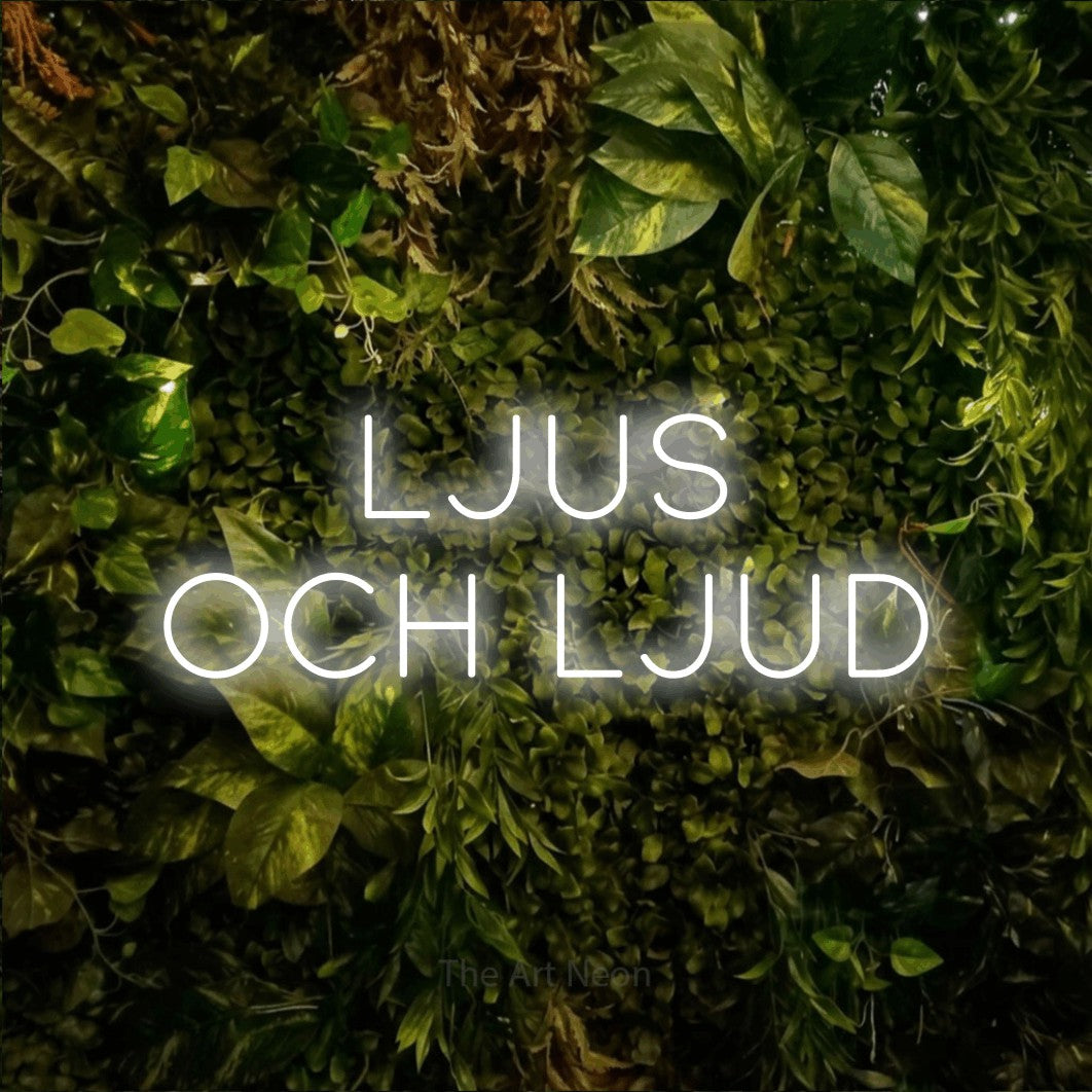 LED neon sign reading “LJUS och ljud”, arranged in 2 lines.