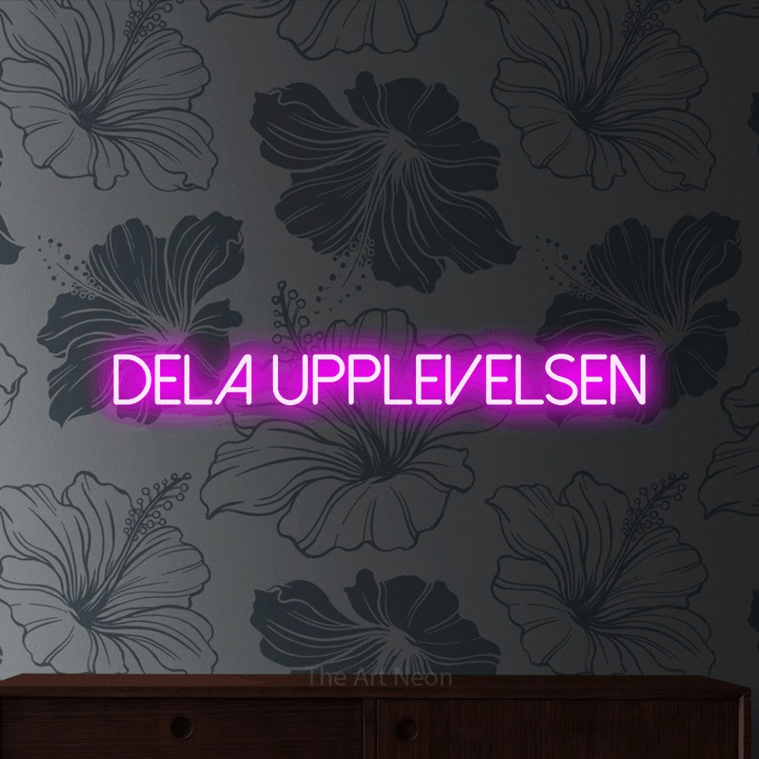 LED neon sign reading “dela UPPLEVELSEN”, arranged in a single line.