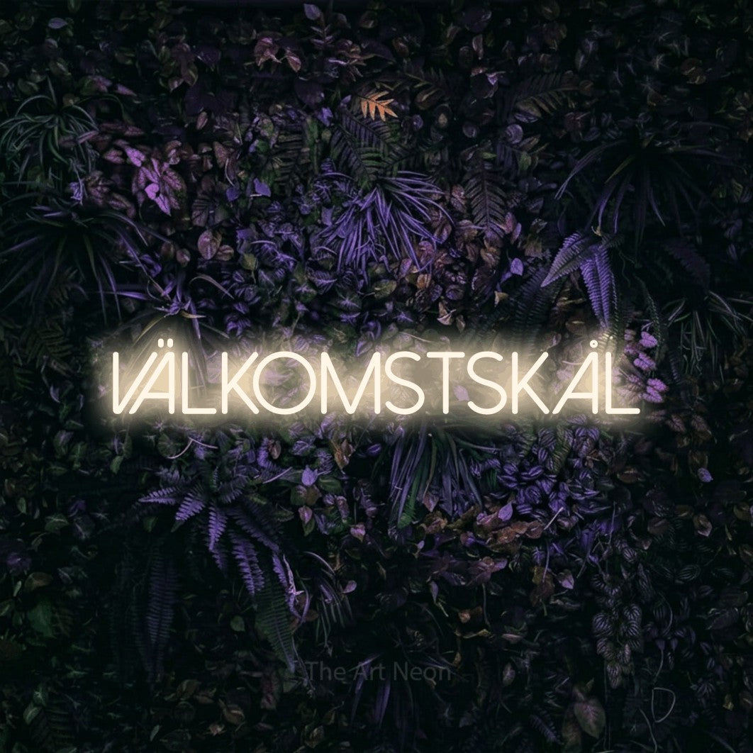 LED neon sign reading “välkomstskål”, arranged in a single line.