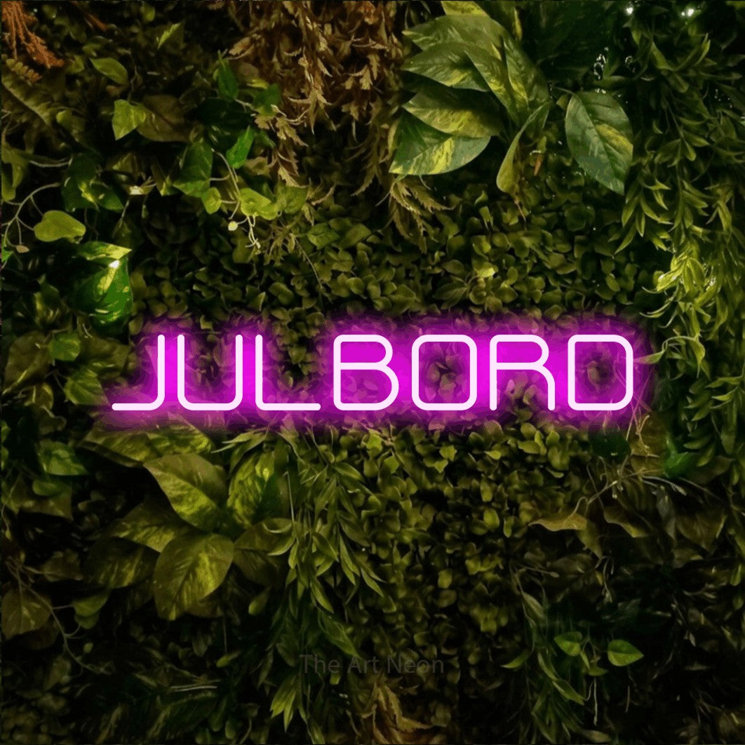 LED neon sign reading “JULBORD”, arranged in a single line.