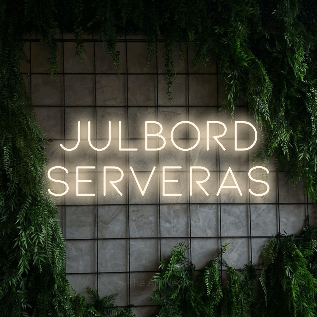 LED neon sign reading “julbord serveras”, arranged in 2 lines.