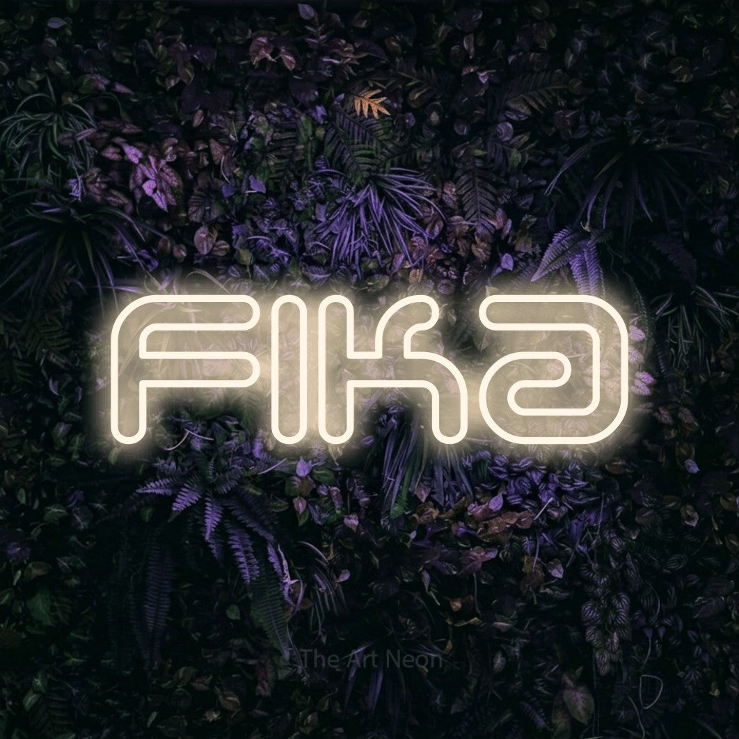 LED neon sign reading “fika”, arranged in a single line.