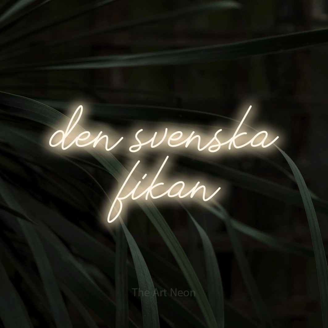 LED neon sign reading “den svenska fikan”, arranged in 2 lines.