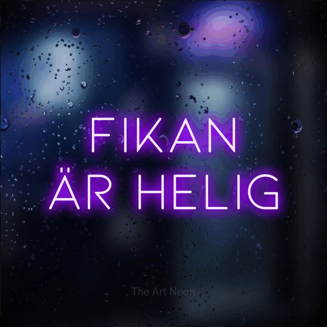 LED neon sign reading “Fikan Är Helig”, arranged in 2 lines.