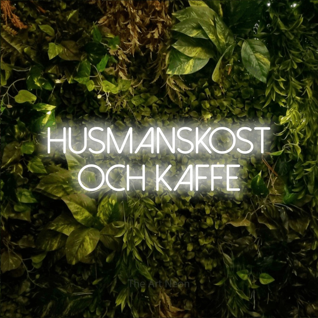 LED neon sign reading “HUSMANSKOST OCH KAFFE”, arranged in 2 lines.