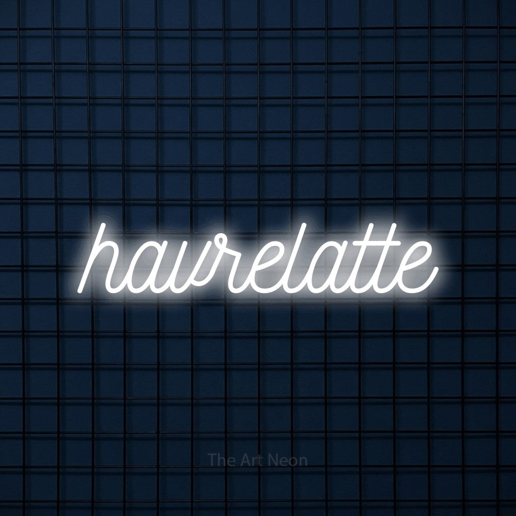 LED neon sign reading “havrelatte”, arranged in a single line.