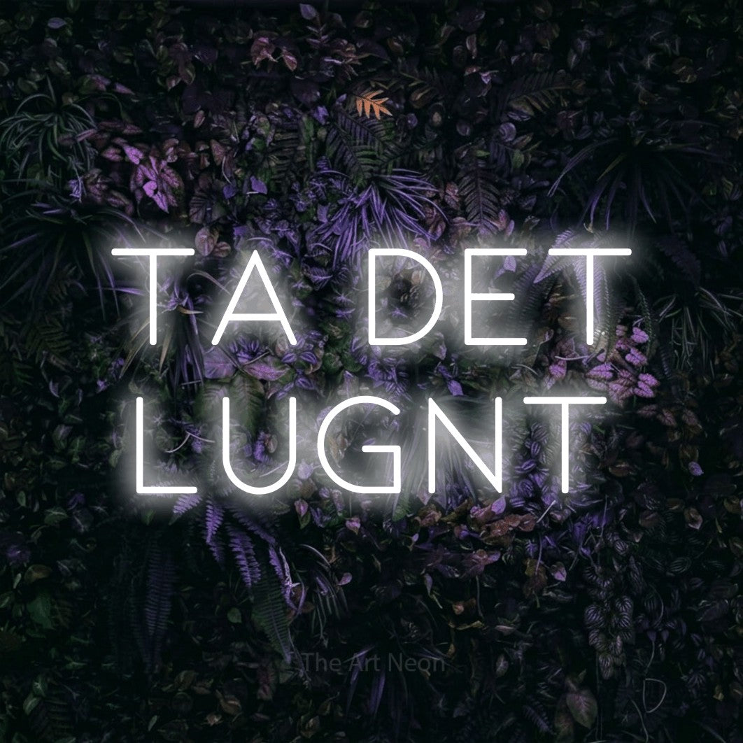 LED neon sign reading “Ta Det Lugnt”, arranged in 2 lines.