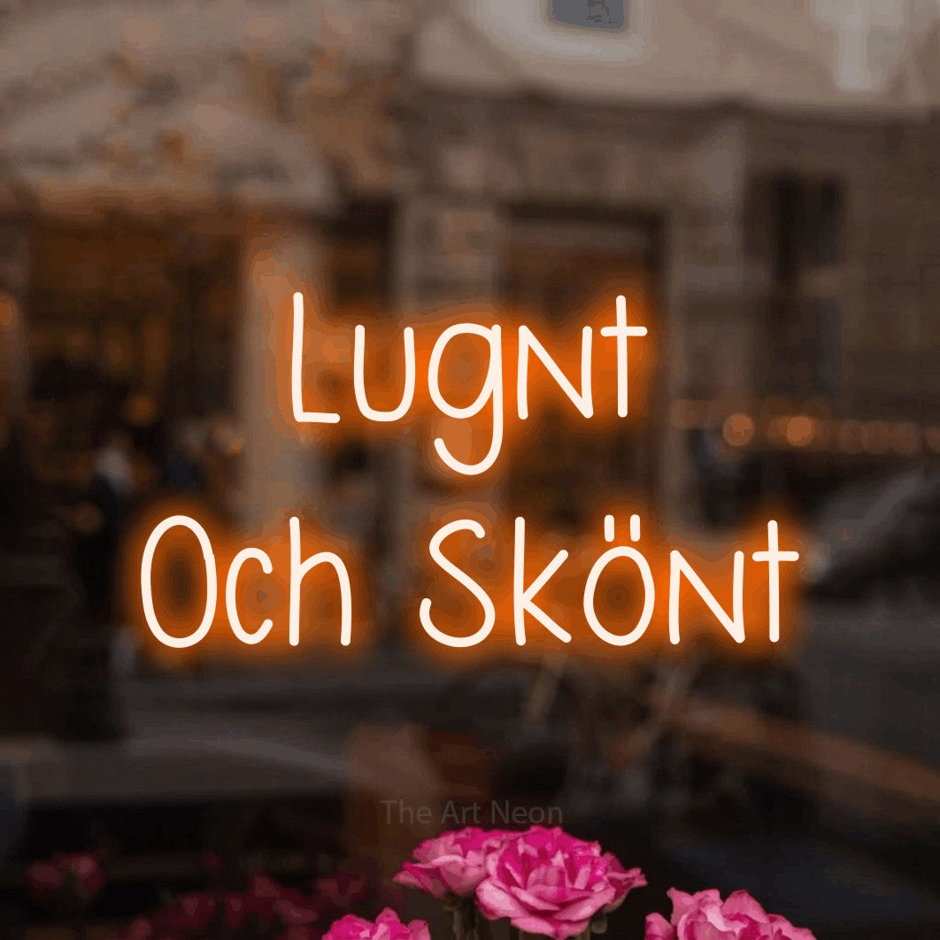 LED neon sign reading “Lugnt Och Skönt”, arranged in 2 lines.