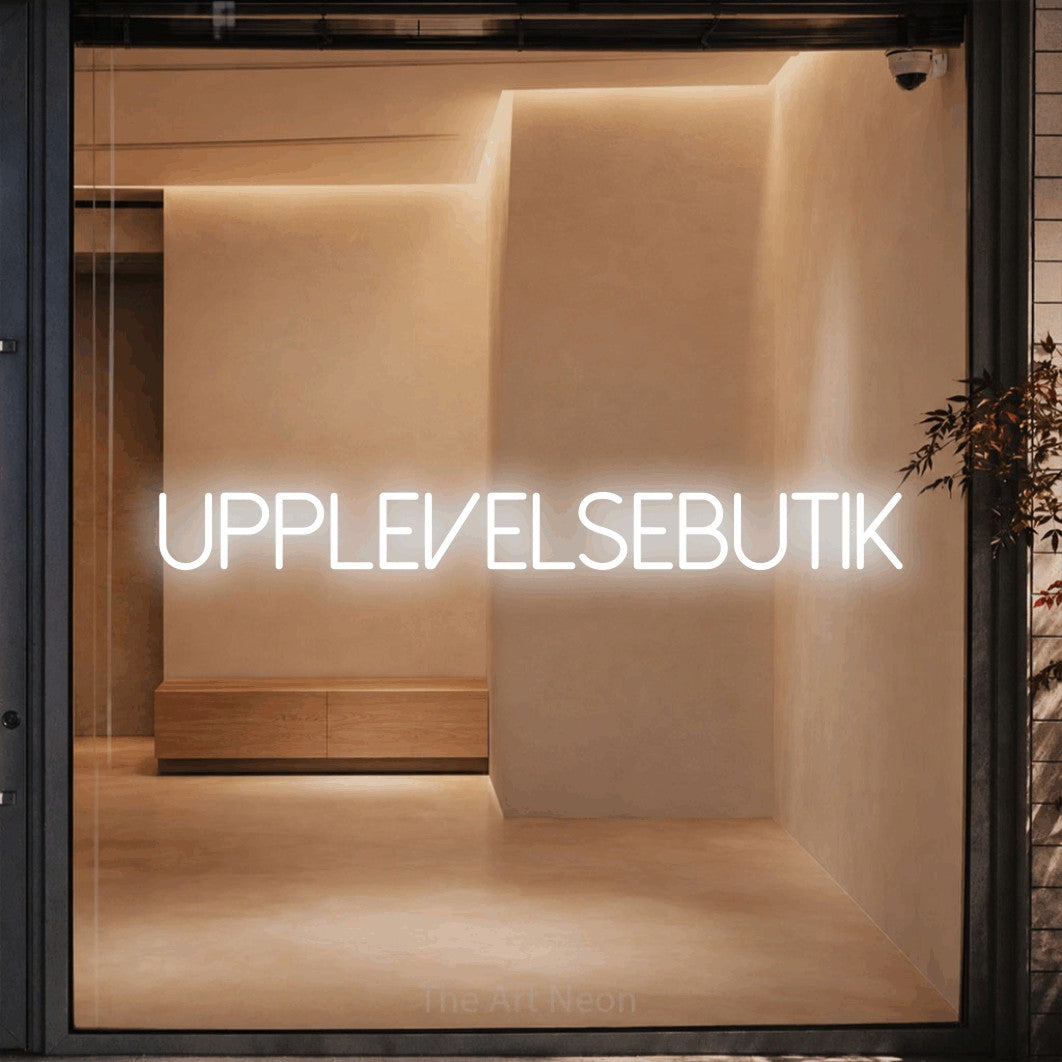 LED neon sign reading “Upplevelsebutik”, arranged in a single line.