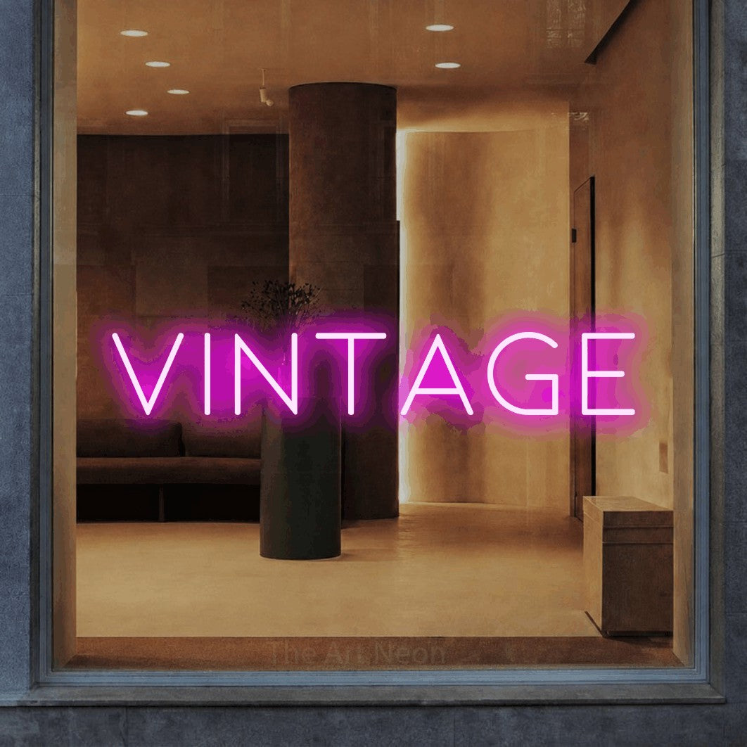 LED neon sign reading “vintage”, arranged in a single line.