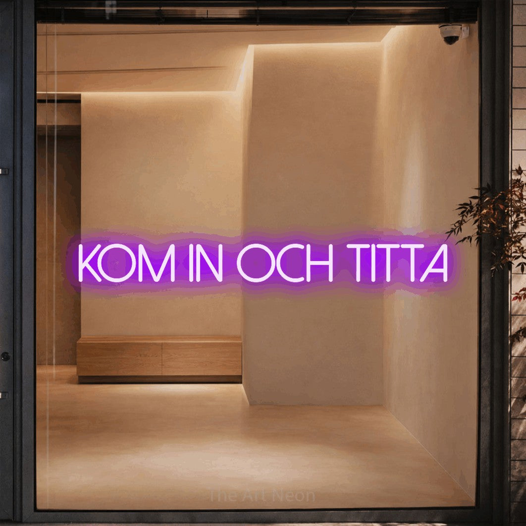 LED neon sign reading “kom in och titta”, arranged in a single line.