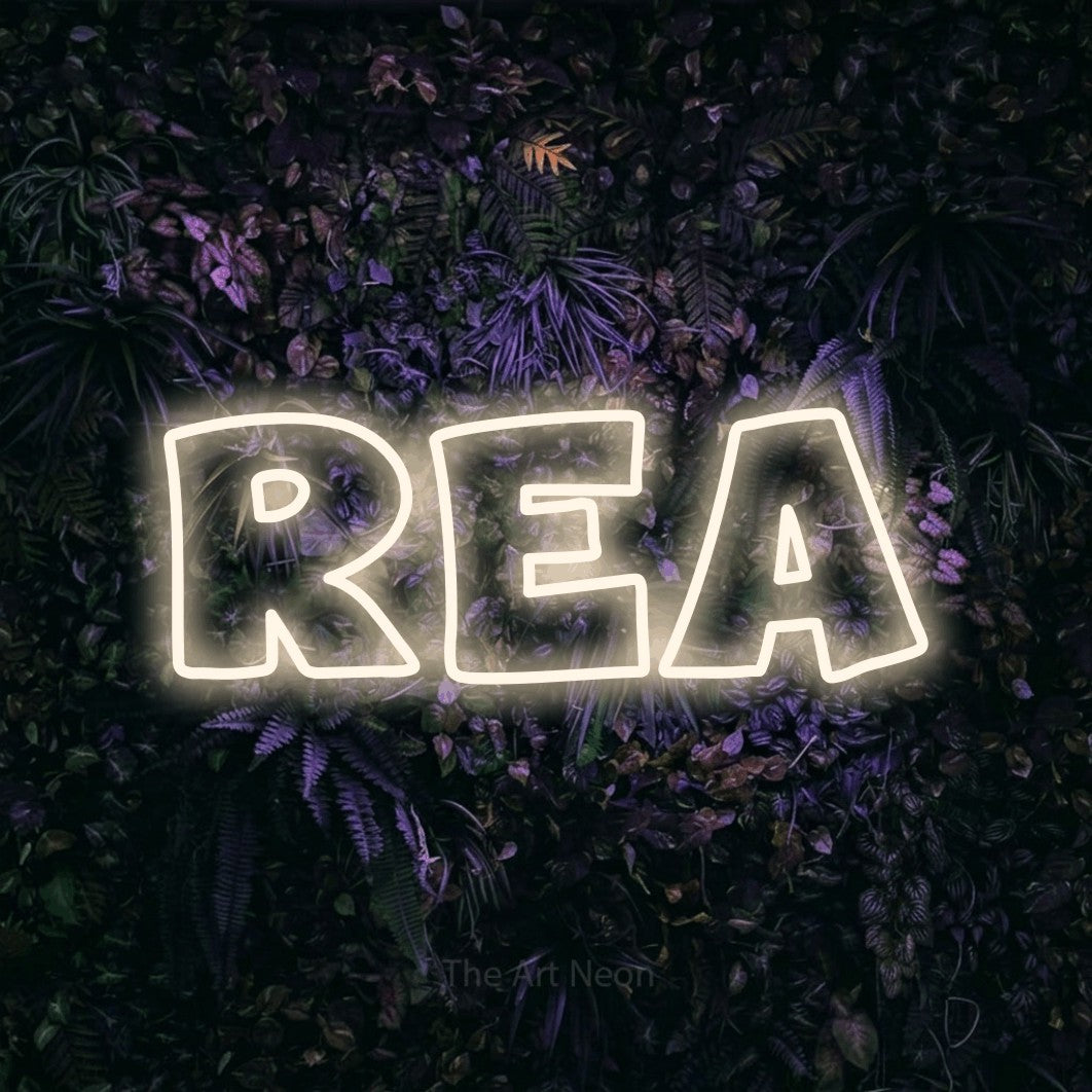 LED neon sign reading “REA”, arranged in a single line.