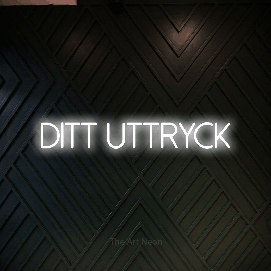 LED neon sign reading “DITT UTTRYCK”, arranged in a single line.