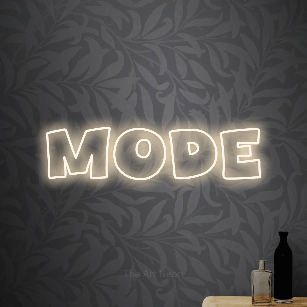 LED neon sign reading “mode”, arranged in a single line.