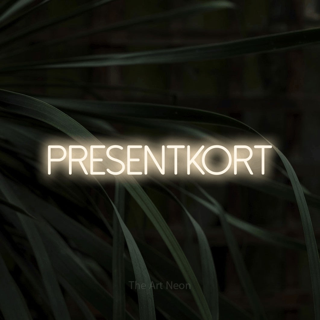 LED neon sign reading “PRESENTKORT”, arranged in a single line.