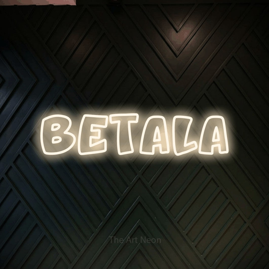 LED neon sign reading “Betala”, arranged in a single line.