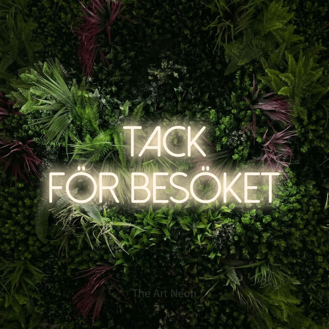 LED neon sign reading “TACK FÖR BESÖKET”, arranged in 2 lines.