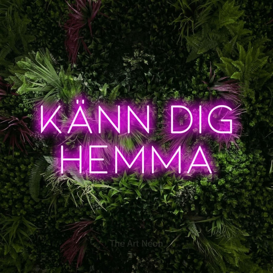 LED neon sign reading “KÄNN DIG HEMMA”, arranged in 2 lines.