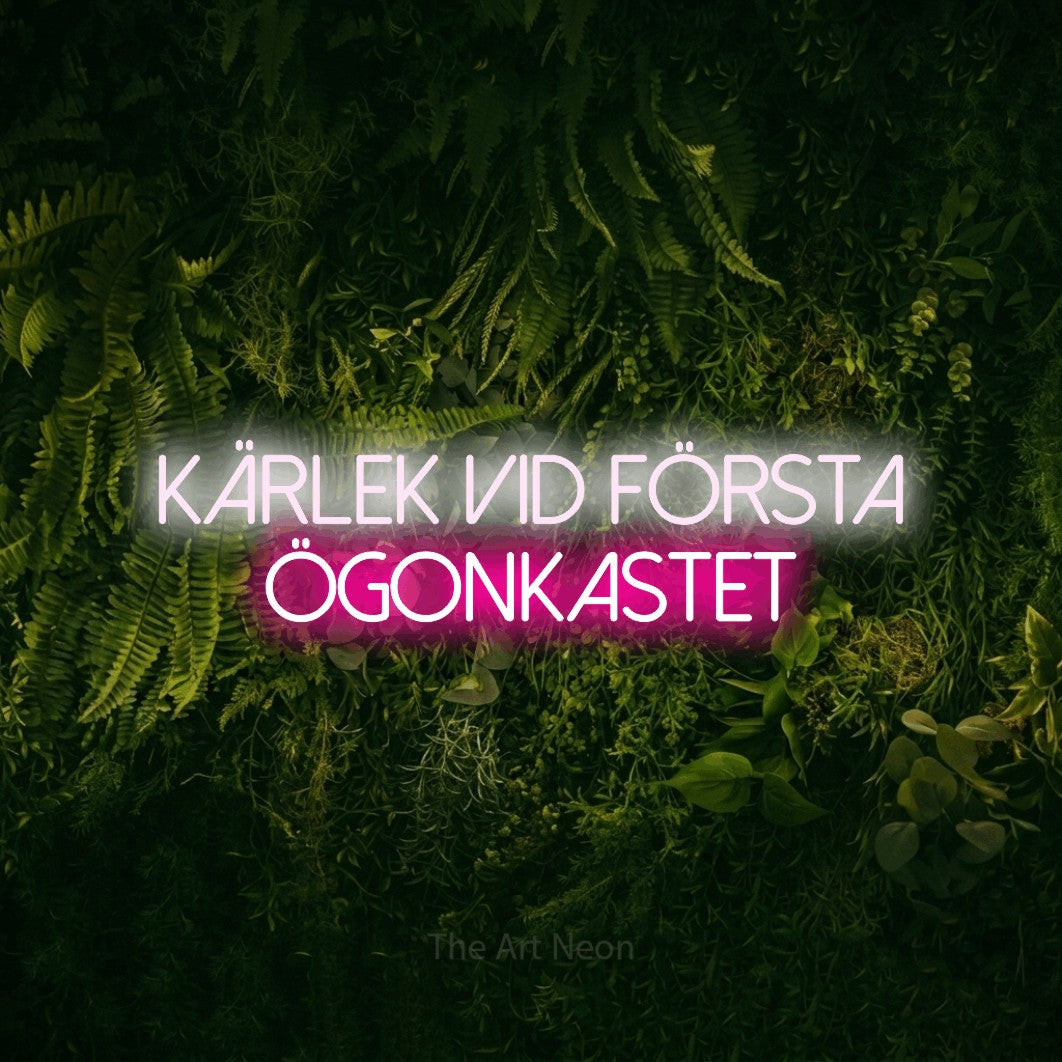 LED neon sign reading “Kärlek Vid Första Ögonkastet”, arranged in 2 lines.