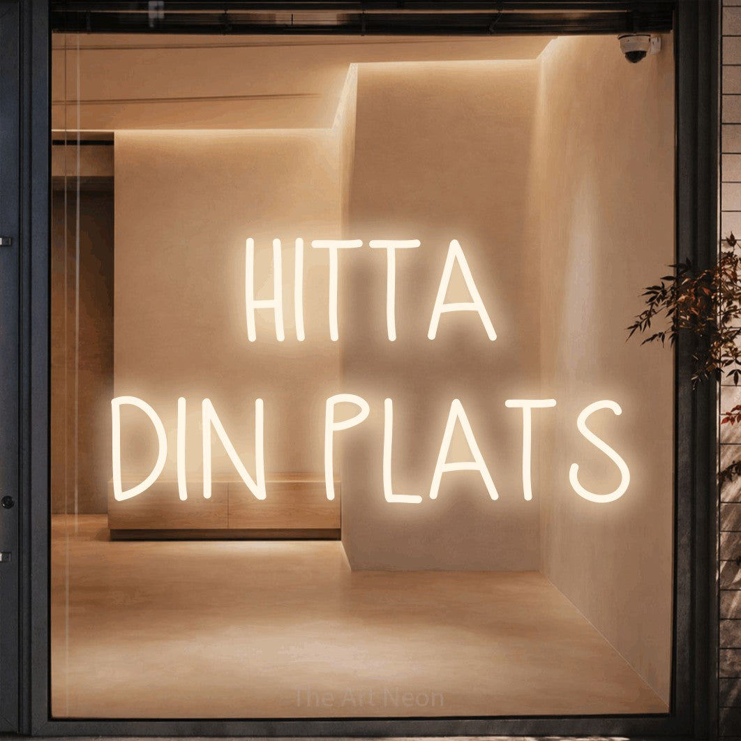 LED neon sign reading “HITTA DIN PLATS”, arranged in 2 lines.