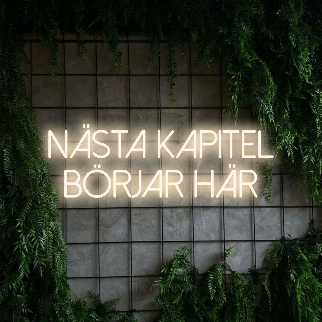 LED neon sign reading “Nästa Kapitel Börjar Här”, arranged in 2 lines.