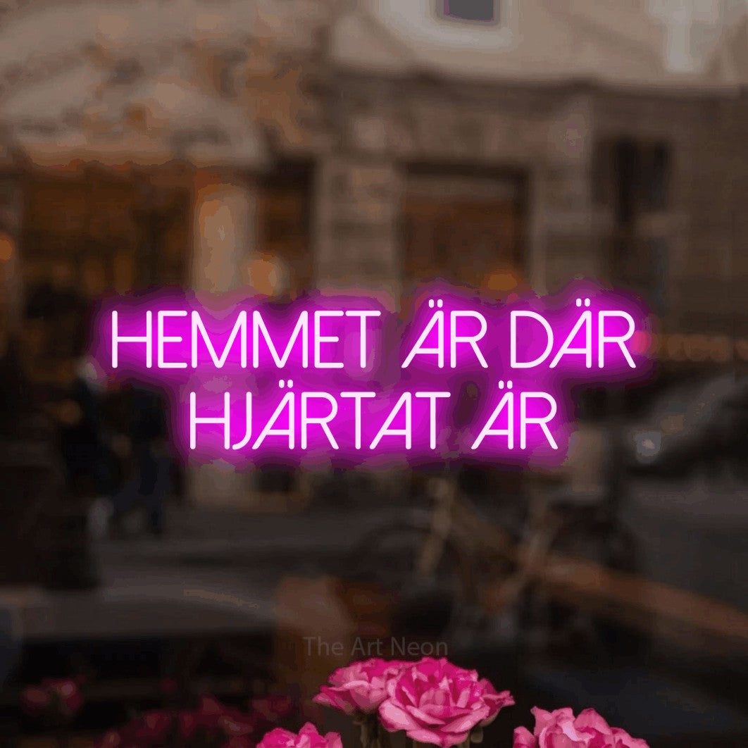 LED neon sign reading “Hemmet Är Där Hjärtat Är”, arranged in 2 lines.