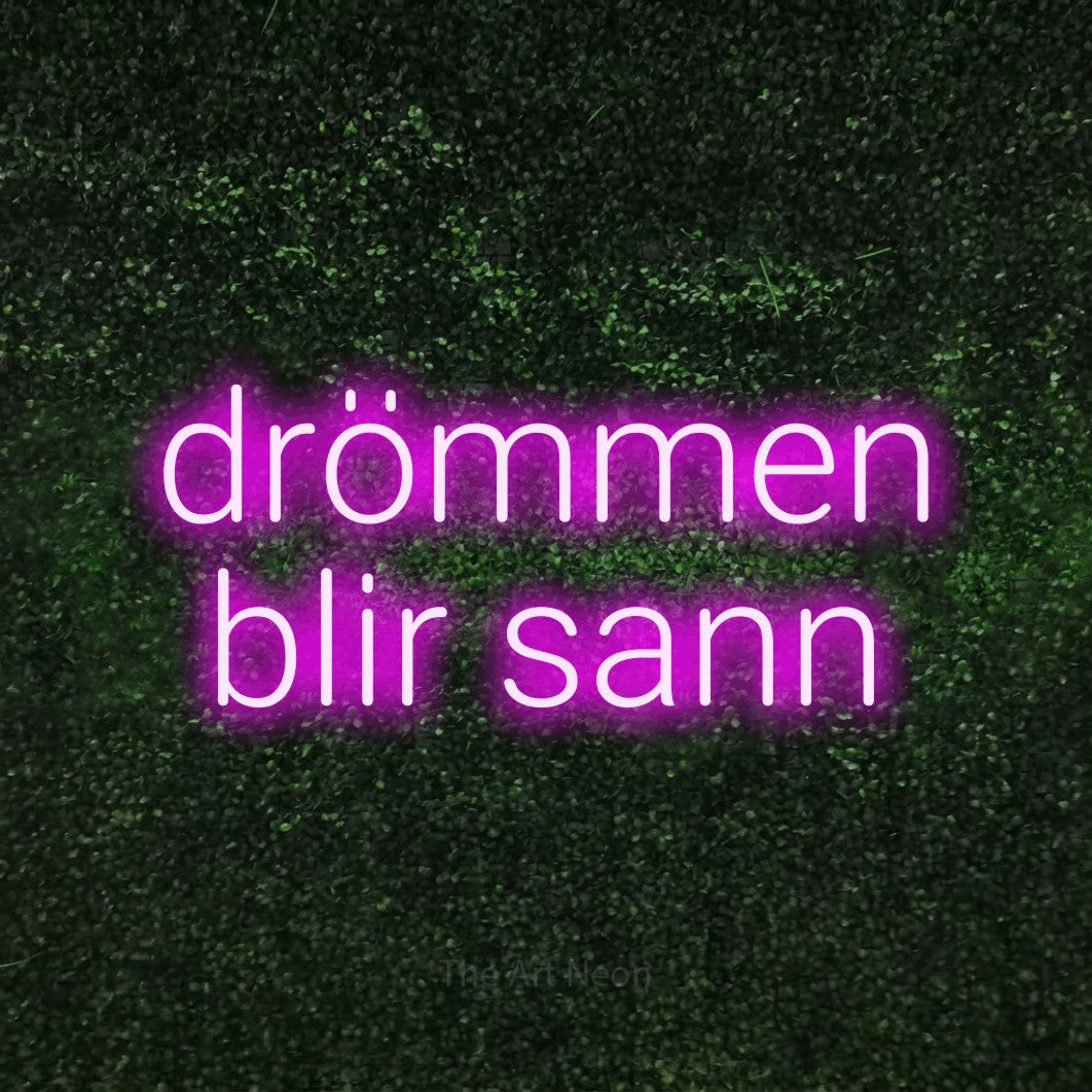 LED neon sign reading “drömmen blir sann”, arranged in 2 lines.