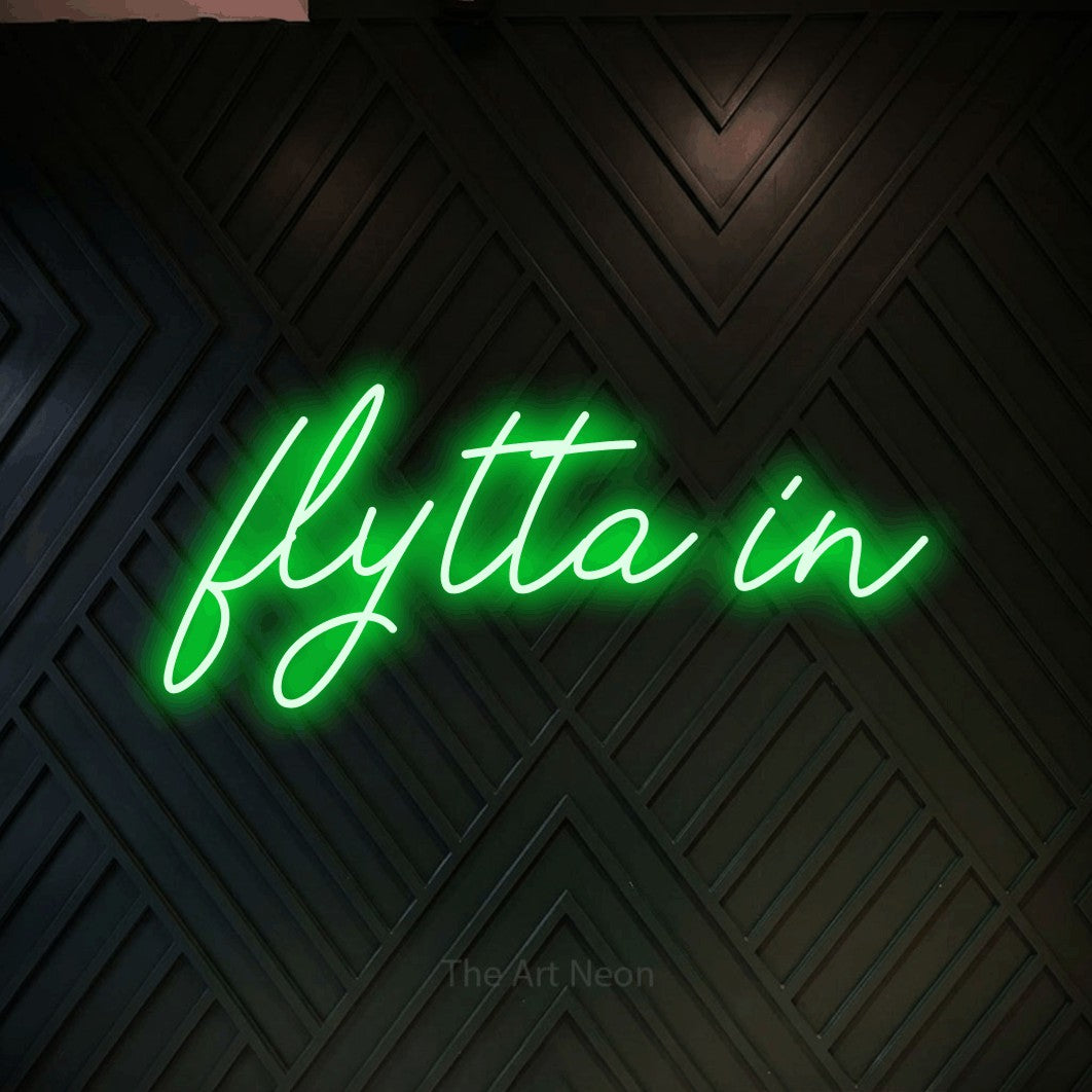 LED neon sign reading “flytta in”, arranged in a single line.