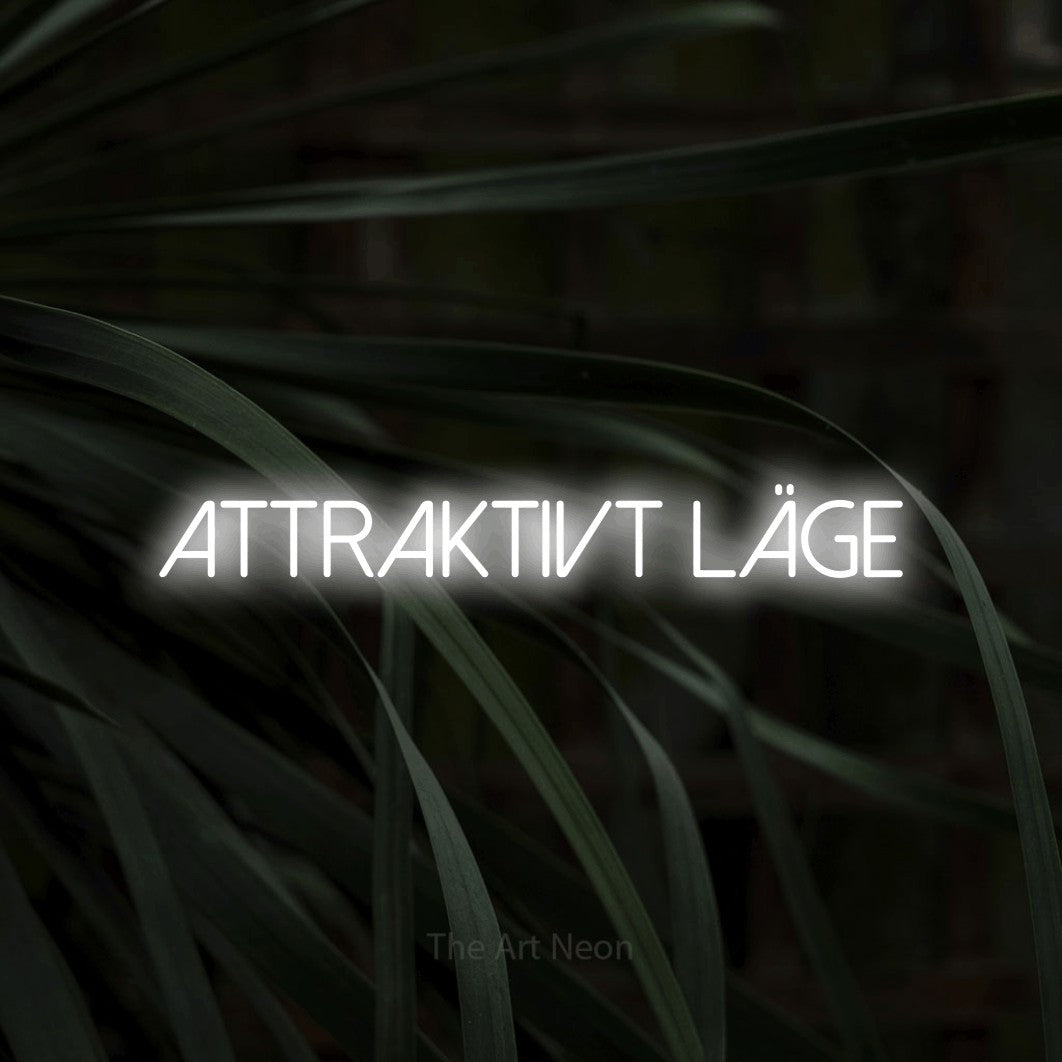 LED neon sign reading “attraktivt läge”, arranged in a single line.