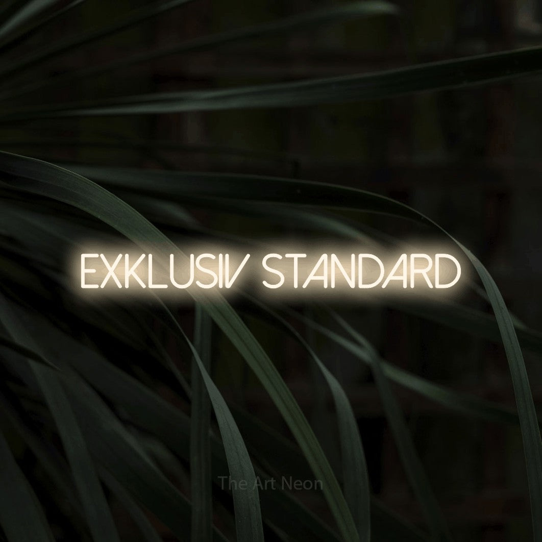 LED neon sign reading “exklusiv standard”, arranged in a single line.
