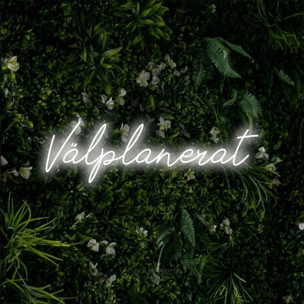 LED neon sign reading “Välplanerat”, arranged in a single line.