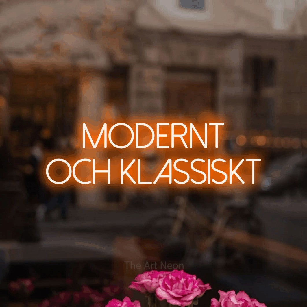 LED neon sign reading “modernt och klassiskt”, arranged in 2 lines.
