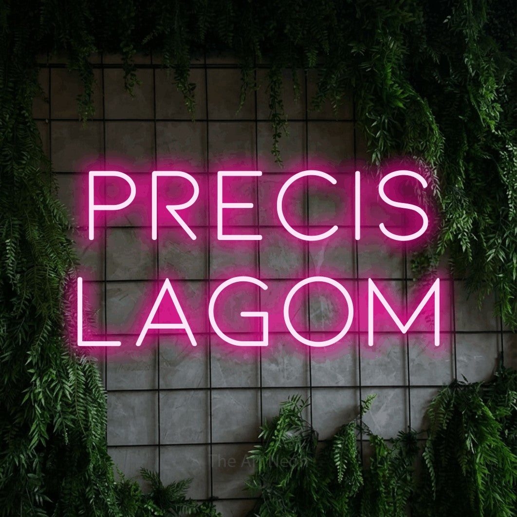 LED neon sign reading “Precis Lagom”, arranged in 2 lines.