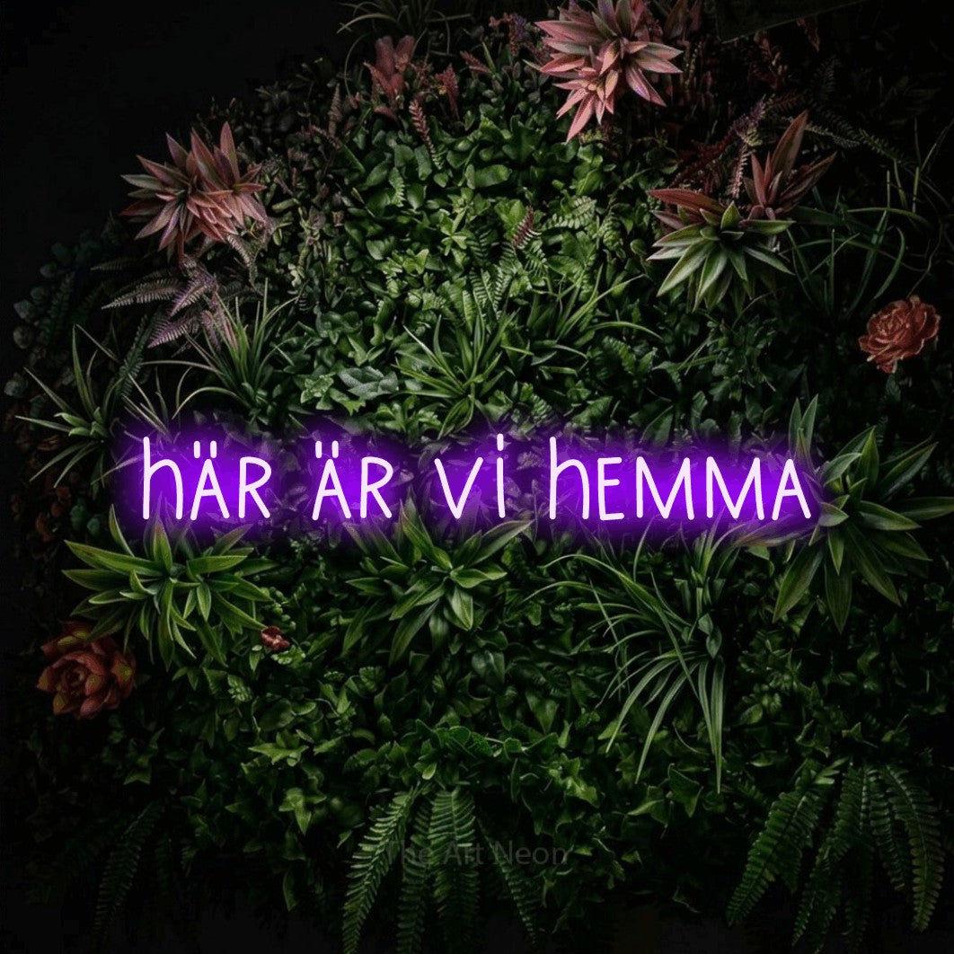 LED neon sign reading “här är vi hemma”, arranged in a single line.