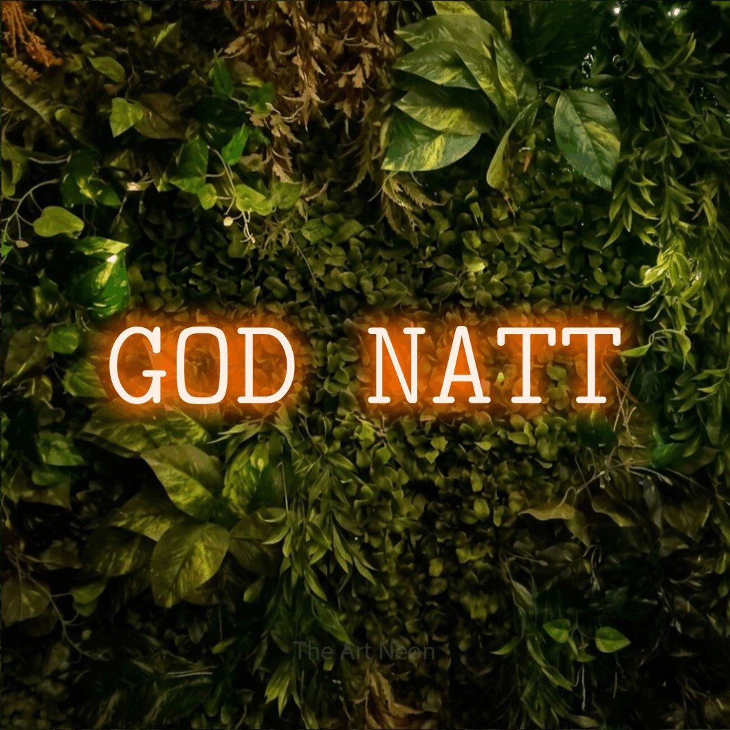 LED neon sign reading “GOD NATT”, arranged in a single line.