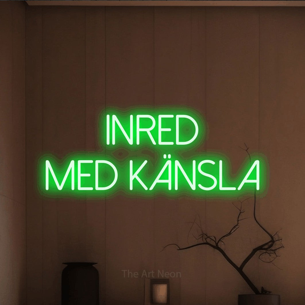 LED neon sign reading “INRED MED KÄNSLA”, arranged in 2 lines.