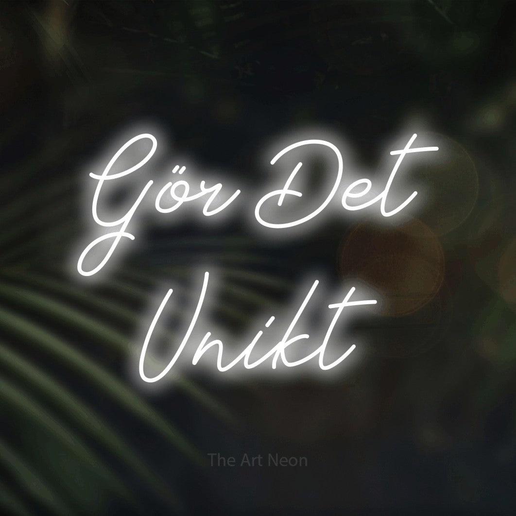 LED neon sign reading “Gör Det Unikt”, arranged in 2 lines.