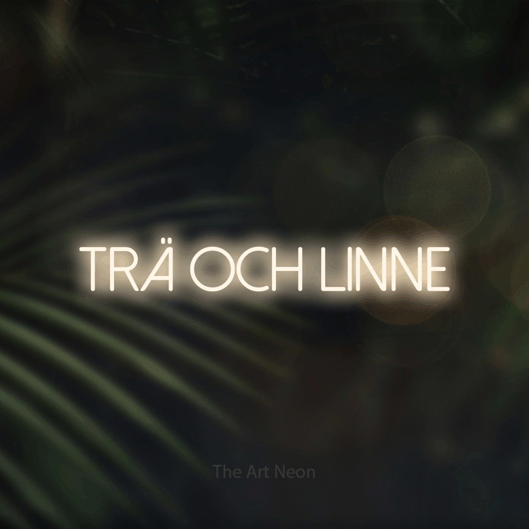 LED neon sign reading “Trä Och Linne”, arranged in a single line.