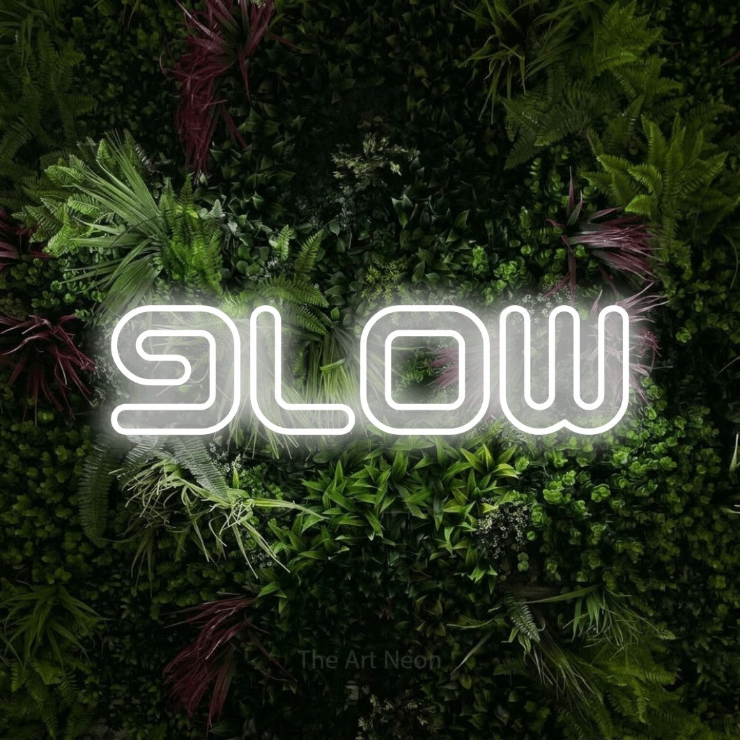 LED neon sign reading “glow”, arranged in a single line.